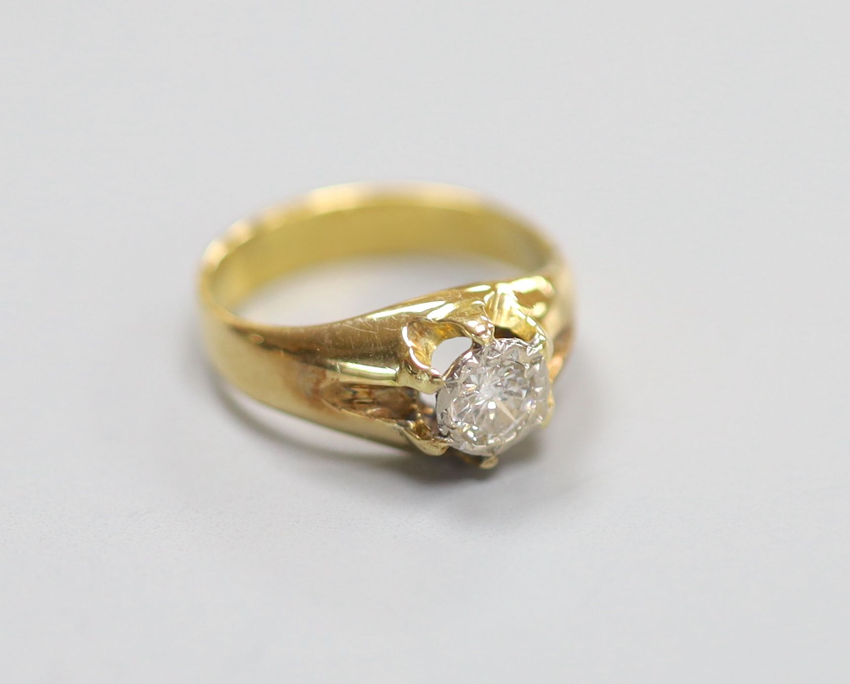 A yellow metal and illusion set solitaire diamond ring, size H, gross 4.4 grams